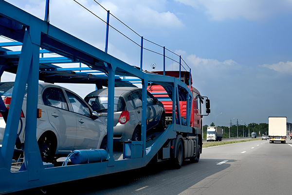 Car transporter with multiple vehicles in transit on UK road