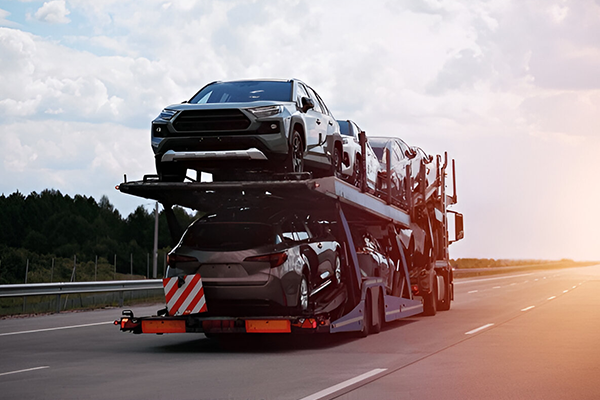 HGV multi-car transporter carrying SUVs on motorway